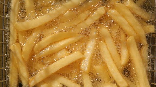French fries are deep fried at fast food restaurant