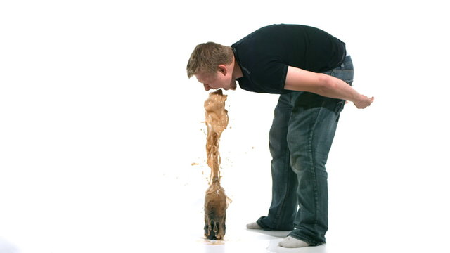 Man with his face in a stream of coke. Slow motion. 