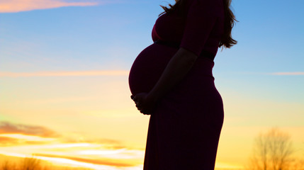 Pregnant Women At Sunset