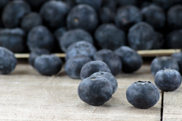 Blueberries in wooden box on wooden table