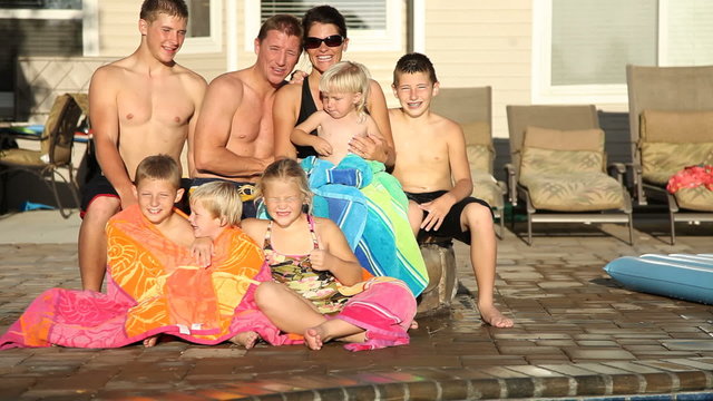 Family portrait by pool