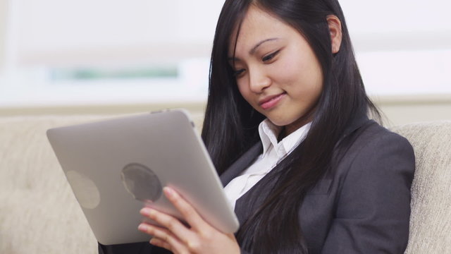 Asian businesswoman using digital tablet