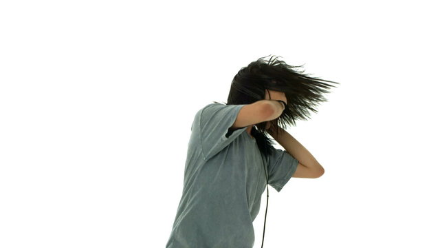 Young man rocking out listening to headphones