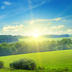 field, sunrise and blue sky