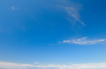 plumose clouds in the blue sky