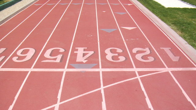 Track runners cross finish line