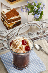 Irish coffee with cherries and tiramisu cake
