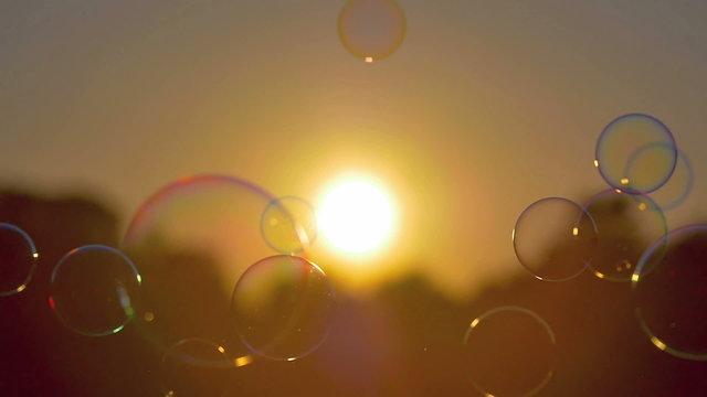 4 in 1 video! The air bubbles by sunset (sunrise) background. Slow motion capture. Shot with Red Cinema Camera