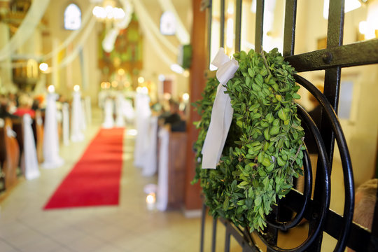 Young Couple During The Wedding Ceremony Before The Altar In A C