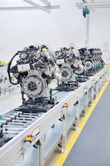 New manufactured car engines on automated production assembly line in a car factory. Manufacture of...