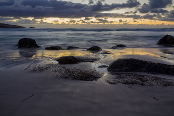 Dramatic Sunset on a deserted rocky Beach