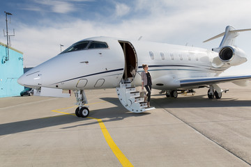 A executive business woman leaving a plane