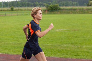 woman jogging outdoor on a racecourse