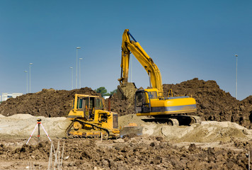 Excavator and bulldozer