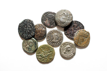 Vintage coins with portraits of kings on a white background