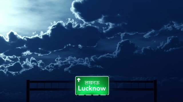 Passing under Lucknow India Highway Road Sign at Night
  