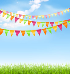 Green grass lawn with bright buntings clouds on blue sky