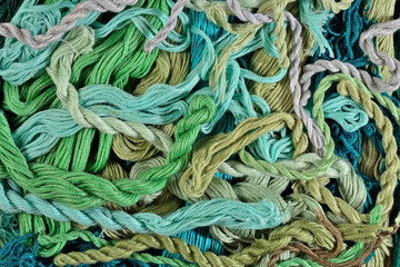 Colorful embroidery floss as background texture close up