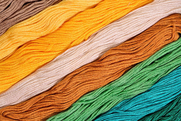 Colorful skeins of floss as background texture