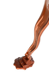 Chocolate flow isolated on white background close up