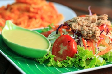 Tuna salad on lettuce and cream sauce