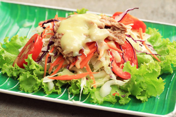 Tuna salad on lettuce and cream sauce