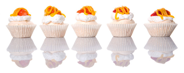 Mini pavlova with strawberry topping over white background