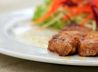 Pork chop, french fries with salad