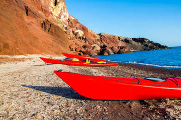 kayaks on the red rocks beach