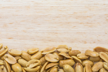 border of  nuts on wood background