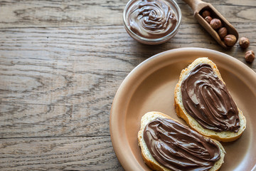 Slices of baguette with chocolate cream