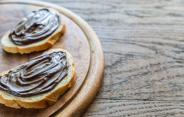 Slices of baguette with chocolate cream