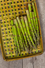 Asparagus on a rustic wooden background. Selective focus.
