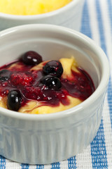 Banana Vanilla Pudding with Blueberry Compote. Selective focus.