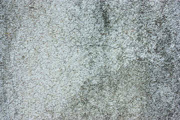 Textured walls with dirt.