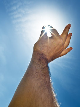 Sun "in the man's hand"