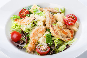 Restaurant food closeup - salad with roasted chicken fillet and