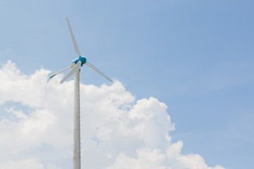 Windmills for electric generator with blue sky and white cloud