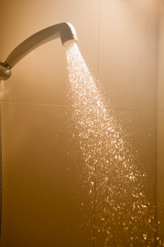hot shower with flowing water and steam