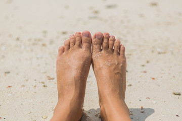 Woman's Bare Feet on the beach.