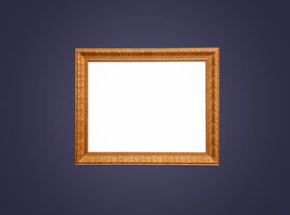 Empty gold frame on blue wall