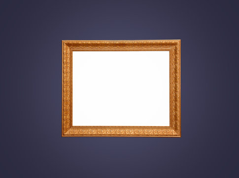 Empty gold frame on blue wall