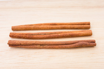 Cinnamon sticks on wooden table