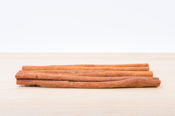 Cinnamon sticks on wooden table