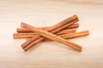 Cinnamon sticks on wooden table