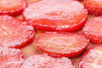 Cut strawberries on wood board