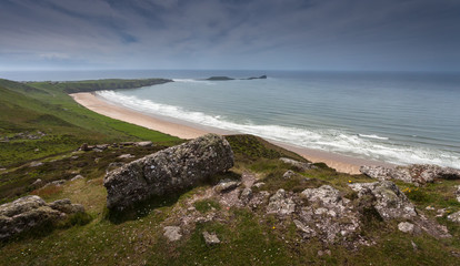 Fototapeta na wymiar View of Worms Head and Rhossili Bay from the top of Rhossili Downs, Gower, Swansea.