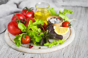ingredients for a fresh salad with tomatoes and garden herbs