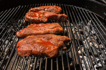 Pork smoked barbeque cooked on charcoal grill