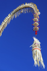 Penjor - house, temple traditional  Balinese symbol and decoration for Galungan hindu religious ceremony, holidays, art festivals. Asian culture tours, backgrounds and details of tropical island Bali © Tropical studio